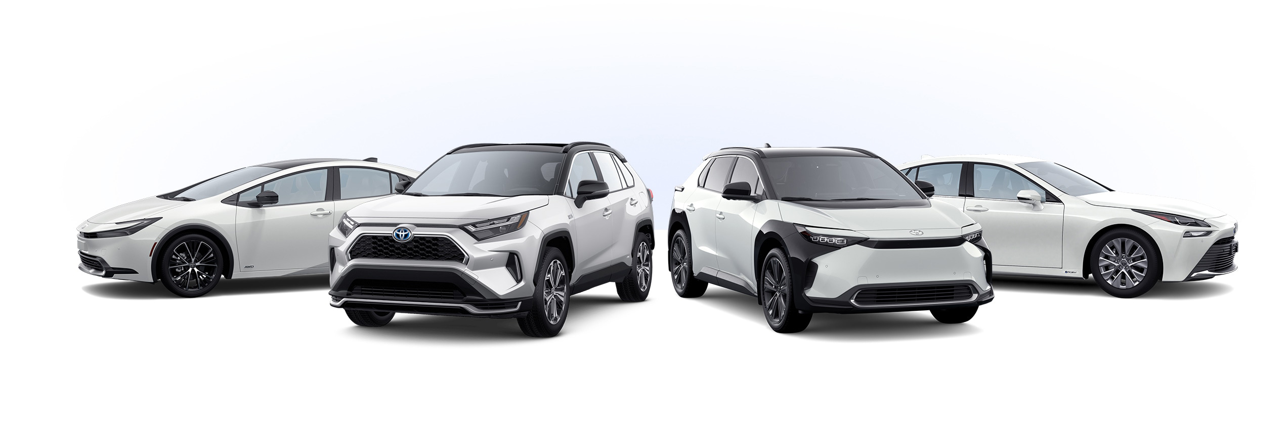 4 white Toyota electrified vehicles