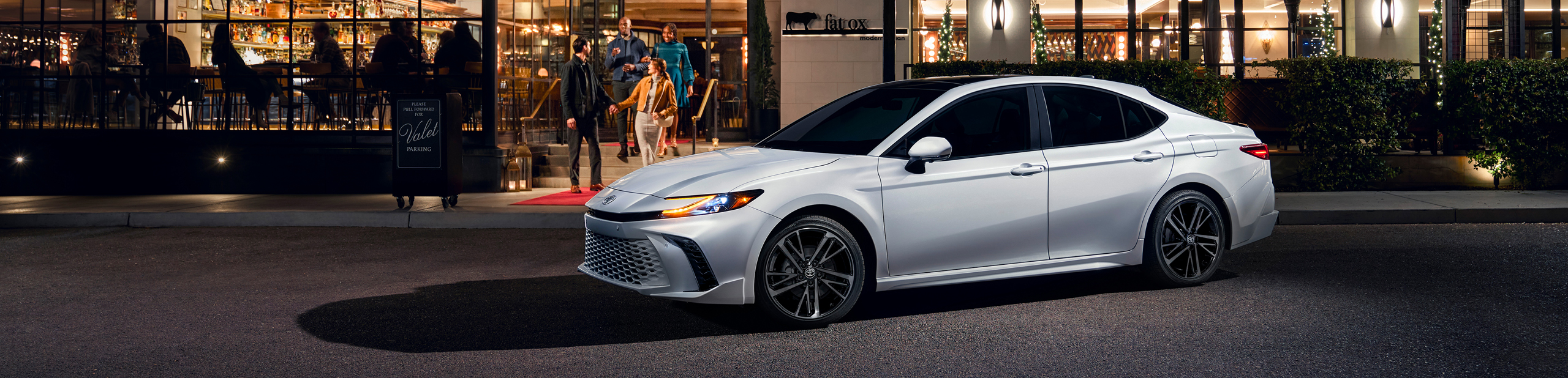 2026 Toyota Camry parked infront restaurant