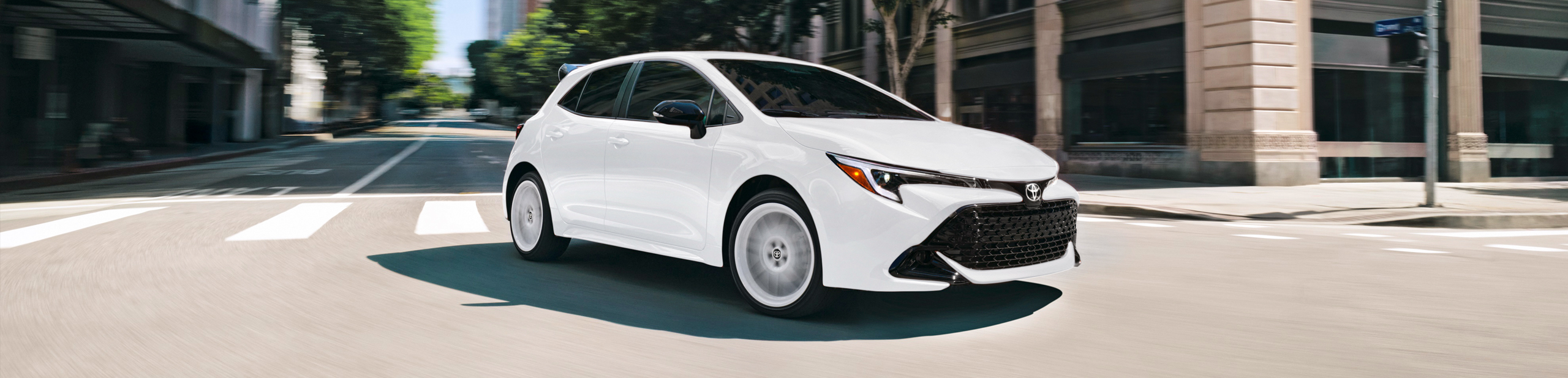 2026 Toyota Corolla Hatchback Driving down street
